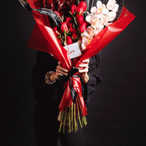 Bouquet or red roses with orchid